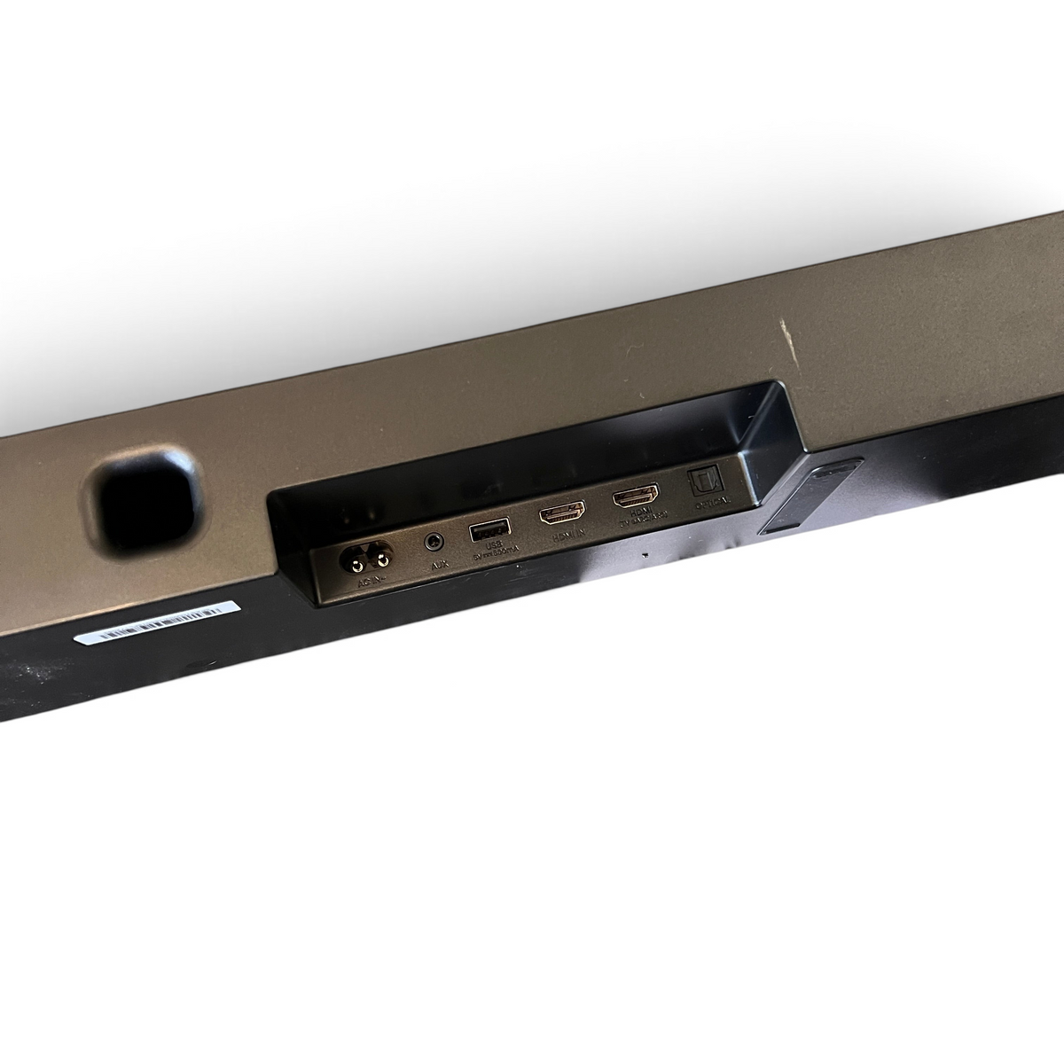 WT Outlets Hisense AX700 5.1.4 channel soundbar rear input panel with remote and manual on grey carpet