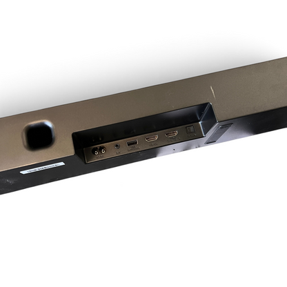 WT Outlets Hisense AX700 5.1.4 channel soundbar rear input panel with remote and manual on grey carpet