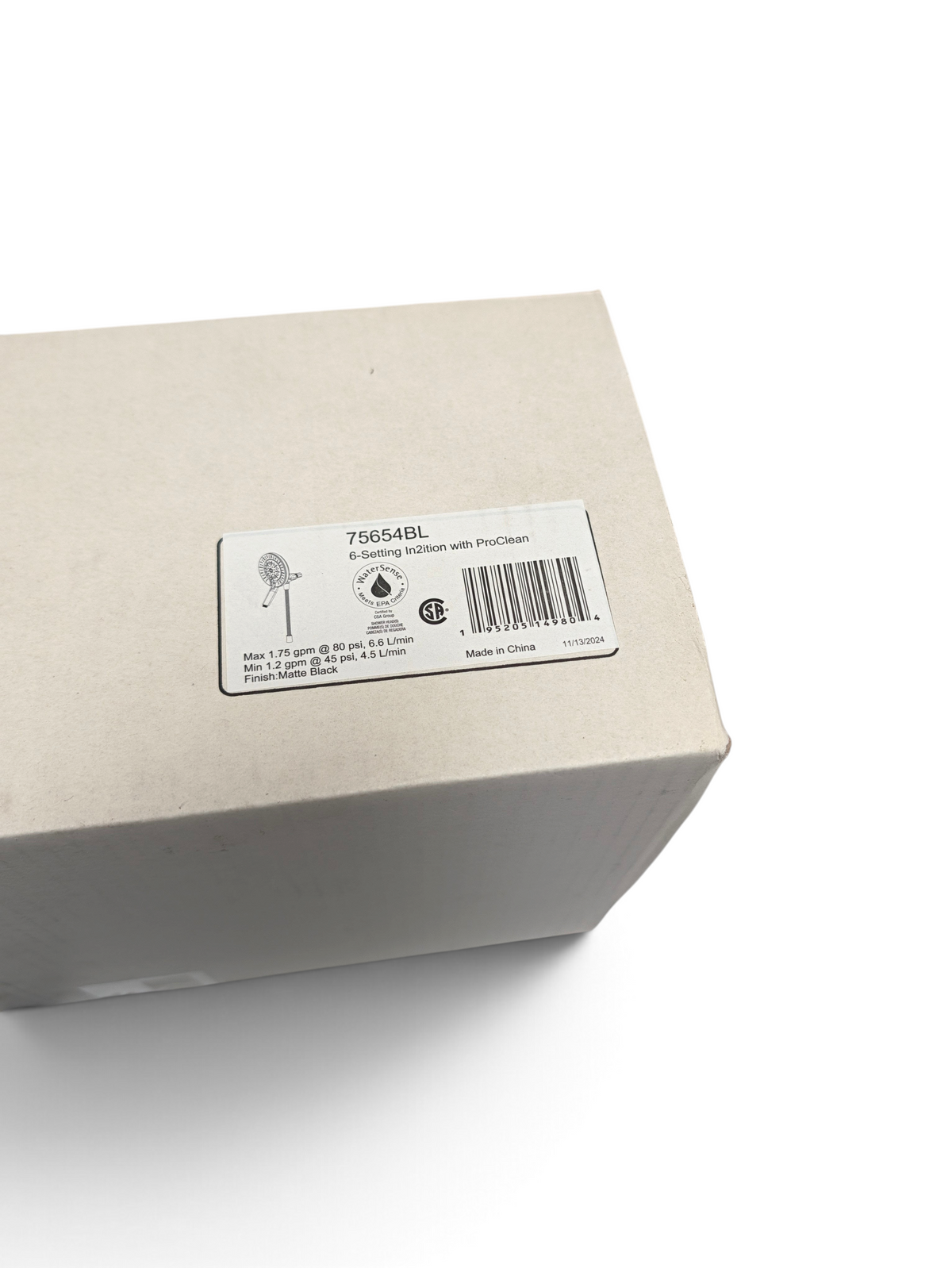WT Outlets Delta 75654BL In2ition 6-setting shower head packaging label in matte black