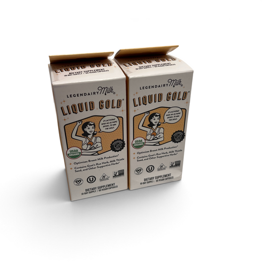 Two boxes of WT Outlets Legendairy Milk Liquid Gold lactation supplement capsules for breast milk production.